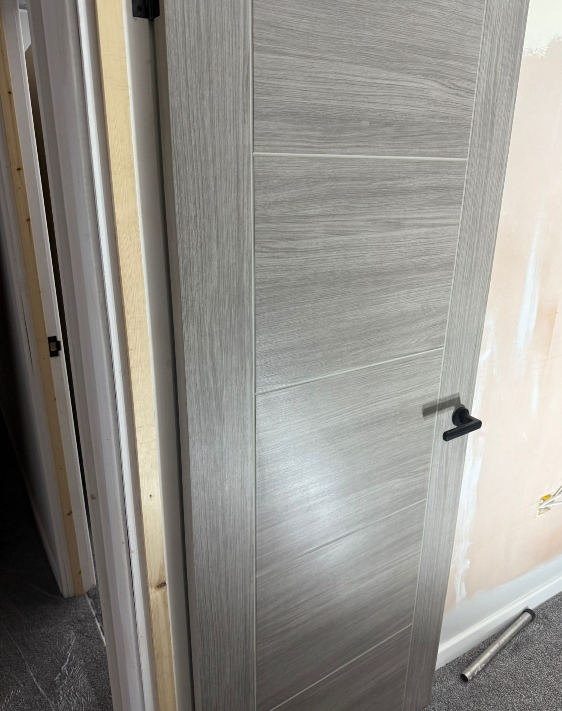 New interior door and plastered walls