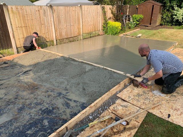 Tradesperson preparing outdoor paving
