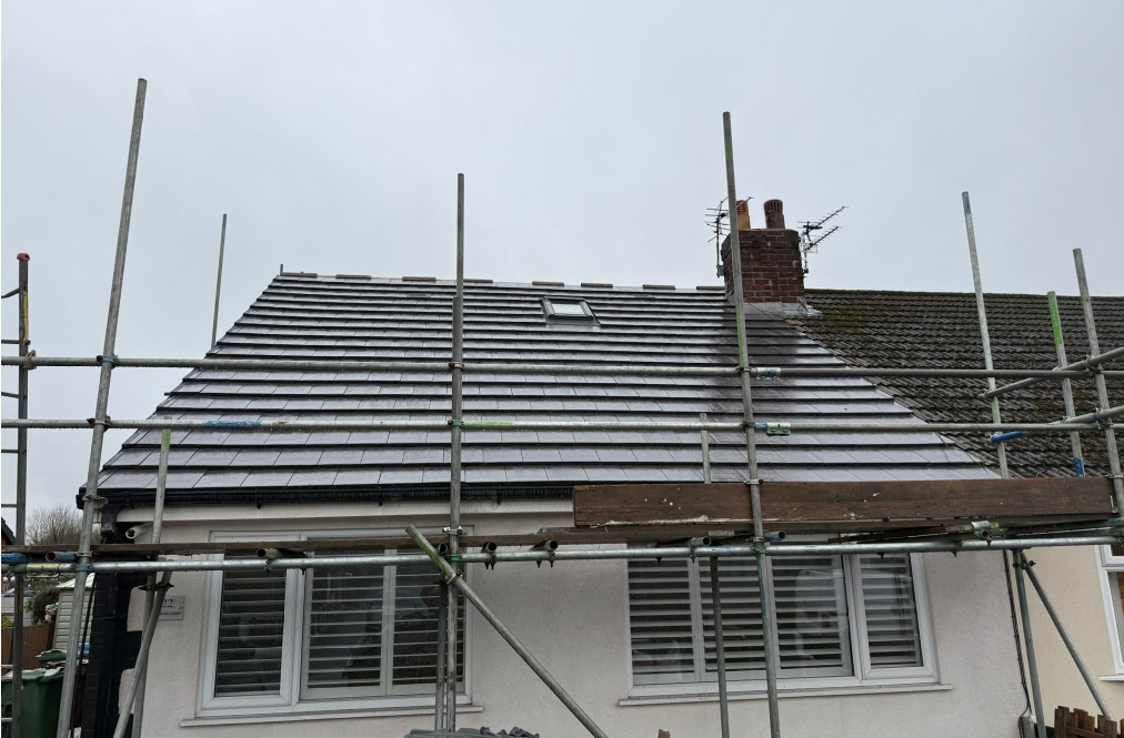 House roof under repair with scaffolding