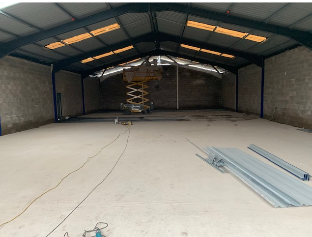 Commercial building interior with steel structure and concrete floor